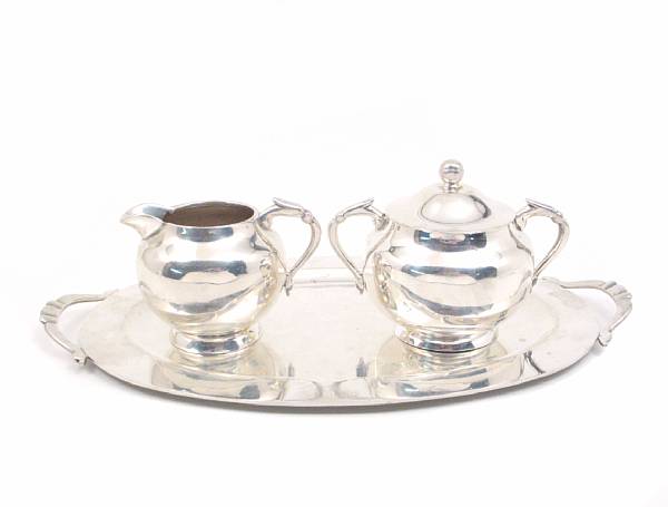 Appraisal: A Mexican sterling creamer sugar bowl and tray Length of