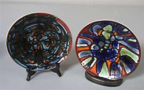 Appraisal: Two Poole pottery plates in polychrome glazes with abstract patterns