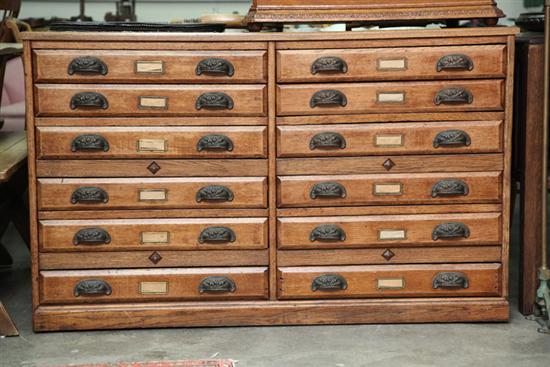 Appraisal: FILE CABINET Oak having twelve drawers with floral decorated pulls