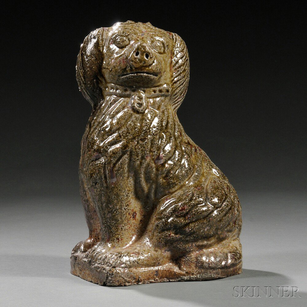 Appraisal: Sewer Tile Pottery Seated Spaniel Figure America with incised detailed