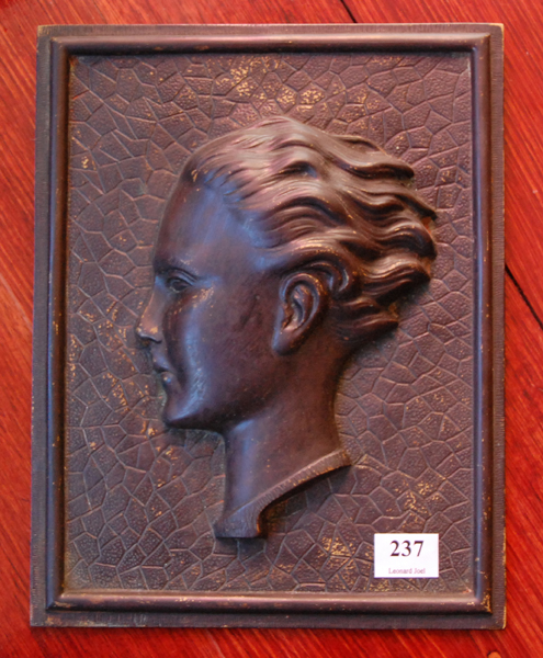 Appraisal: A BRONZE PLAQUE OF A WOMAN IN PROFILE