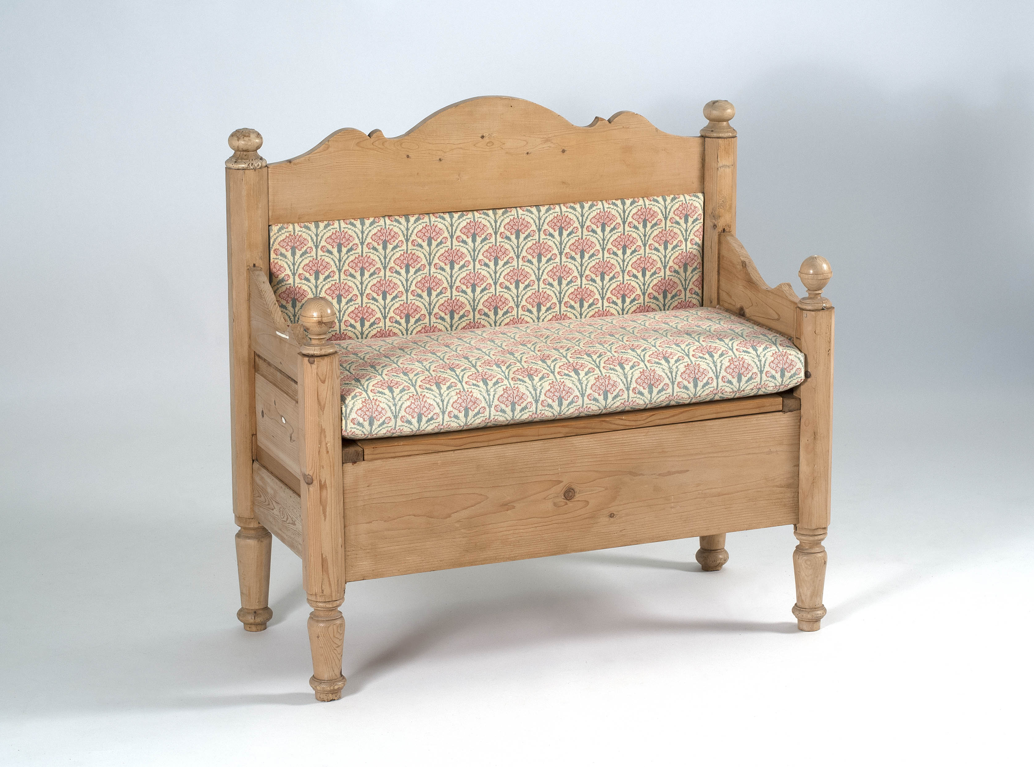 Appraisal: DIMINUTIVE SETTEE in pine Hinged seat with storage area Height