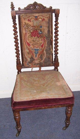 Appraisal: A Victorian walnut framed chair with needlework back and seat