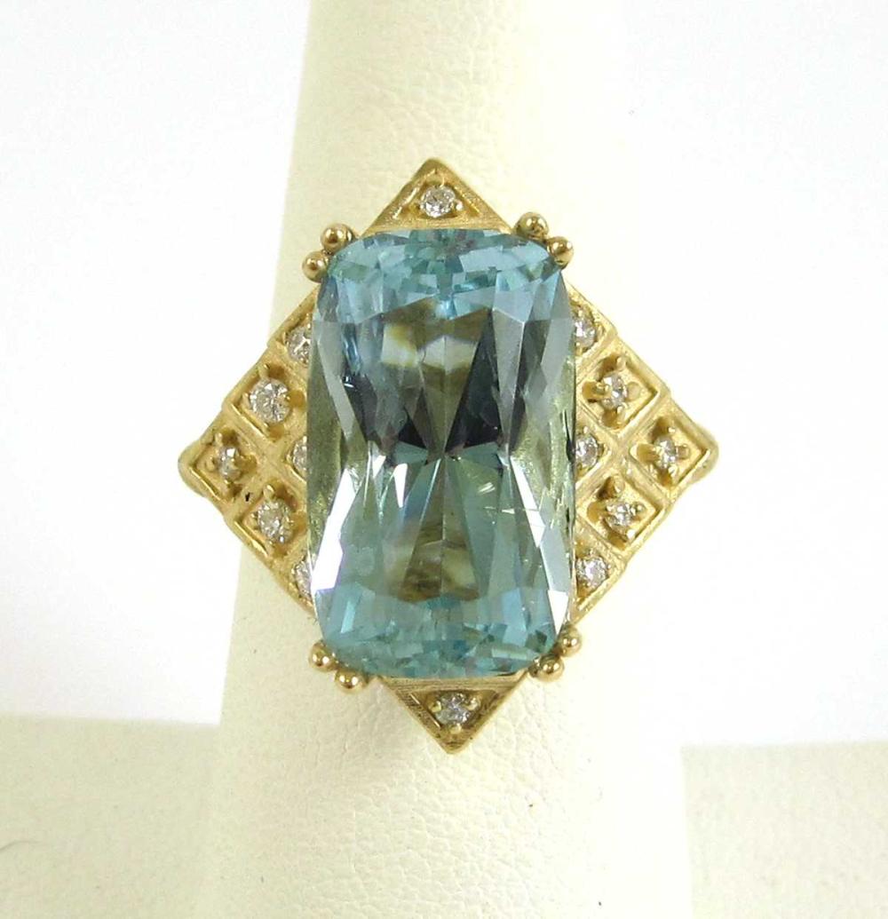 Appraisal: AQUAMARINE DIAMOND AND FOURTEEN KARAT GOLD RING with round-cut diamonds