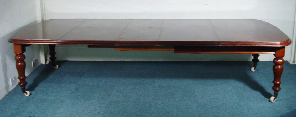 Appraisal: Large Victorian mahogany extending D-end dining table with three extra