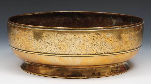 Appraisal: A Sino-Tibetan brass bowl th Centurywith engraved floral band to