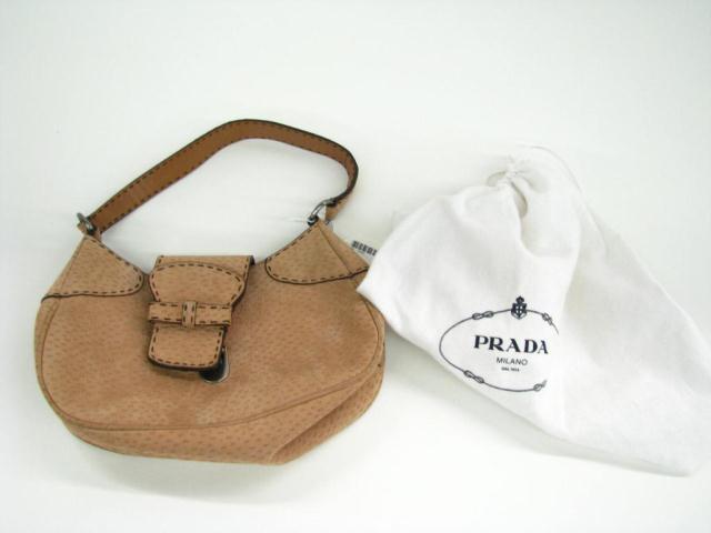 Appraisal: Prada textured suede style St Peccary flap baguette bag with