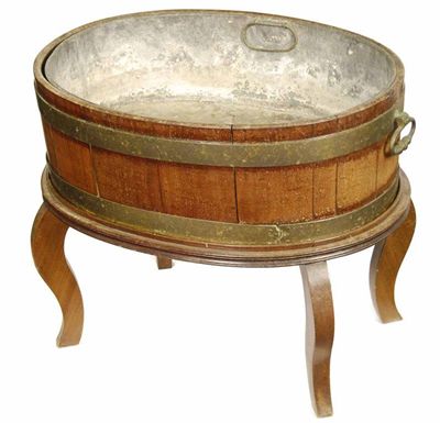 Appraisal: A th century mahogany and brass bound oval wine cooler