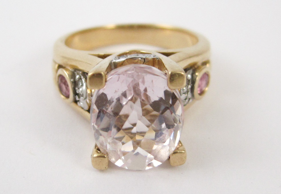 Appraisal: KUNZITE DIAMOND AND FOURTEEN KARAT GOLD RING featuring an oval