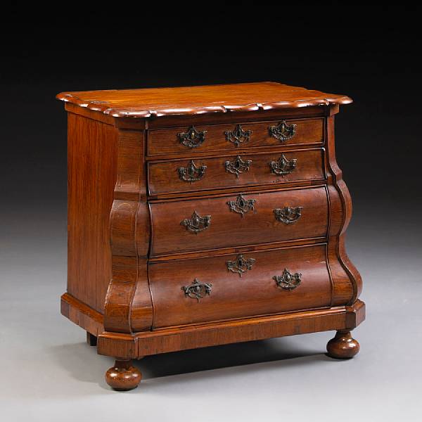 Appraisal: A Dutch Rococo inlaid walnut and rosewood chest of drawers