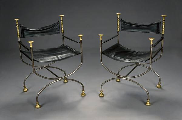 Appraisal: A pair of Italian Renaissance style polished iron and brass