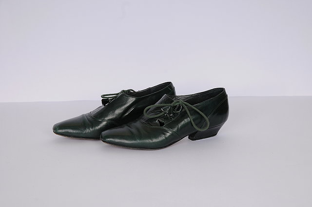 Appraisal: A pair of dark green lace up leather brogues by