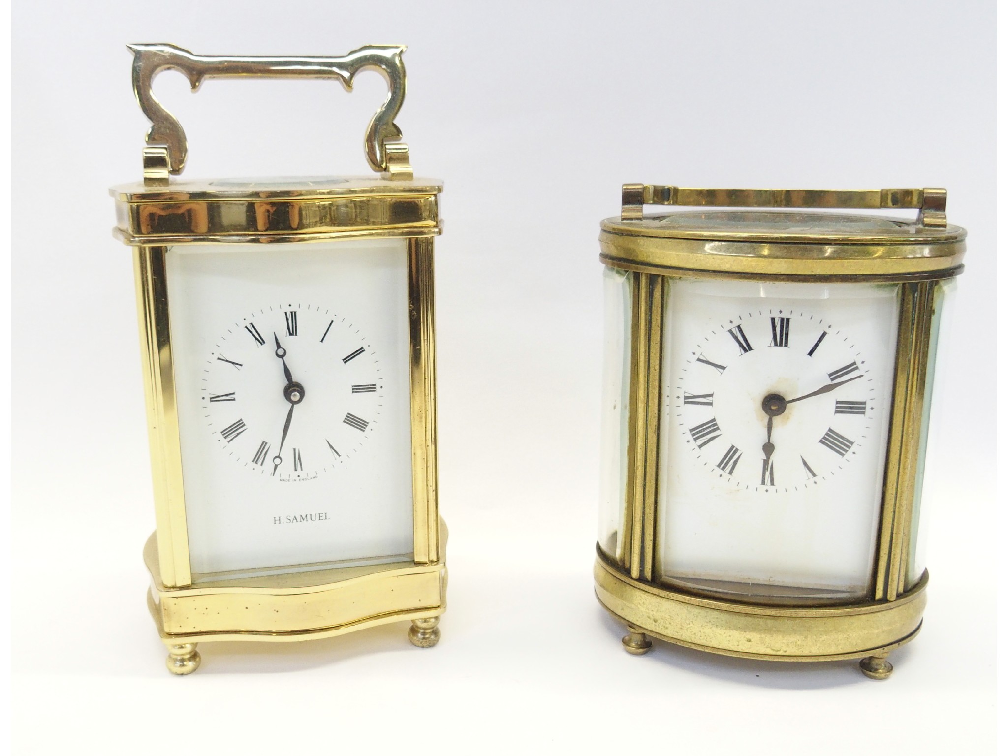 Appraisal: Two brass and glass carriage clocks one marked H Samuel