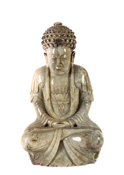 Appraisal: A carved hardstone figure of a seated Buddha height in