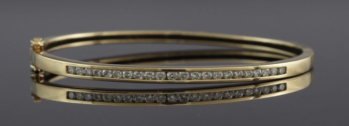 Appraisal: Fourteen-Karat Yellow Gold and Diamond Bangle Bracelet the squared outline