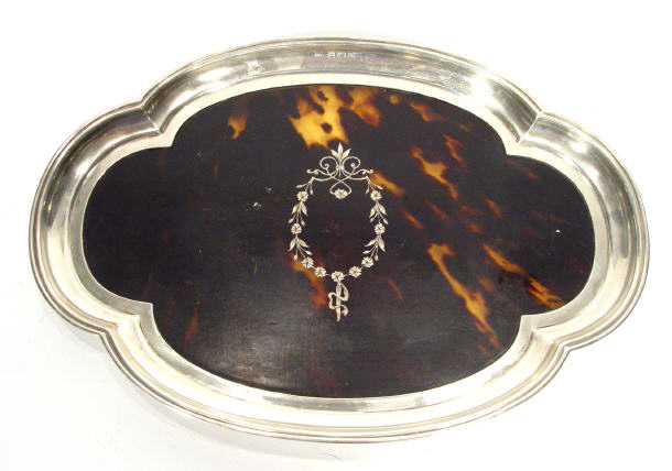 Appraisal: Shaped oval silver and tortoiseshell tray with floral swag design