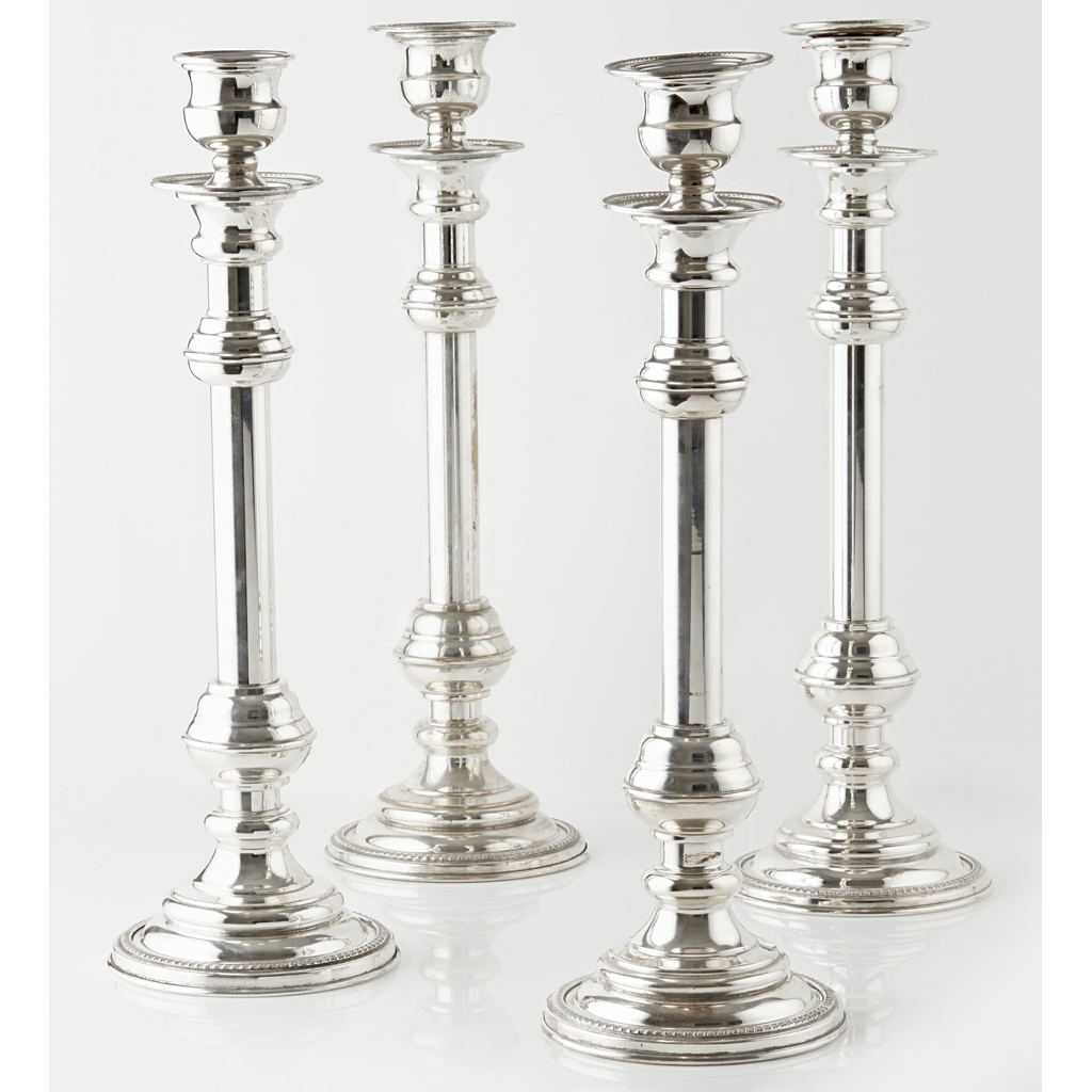 Appraisal: A set of four silver plated altar candlesticks of knopped