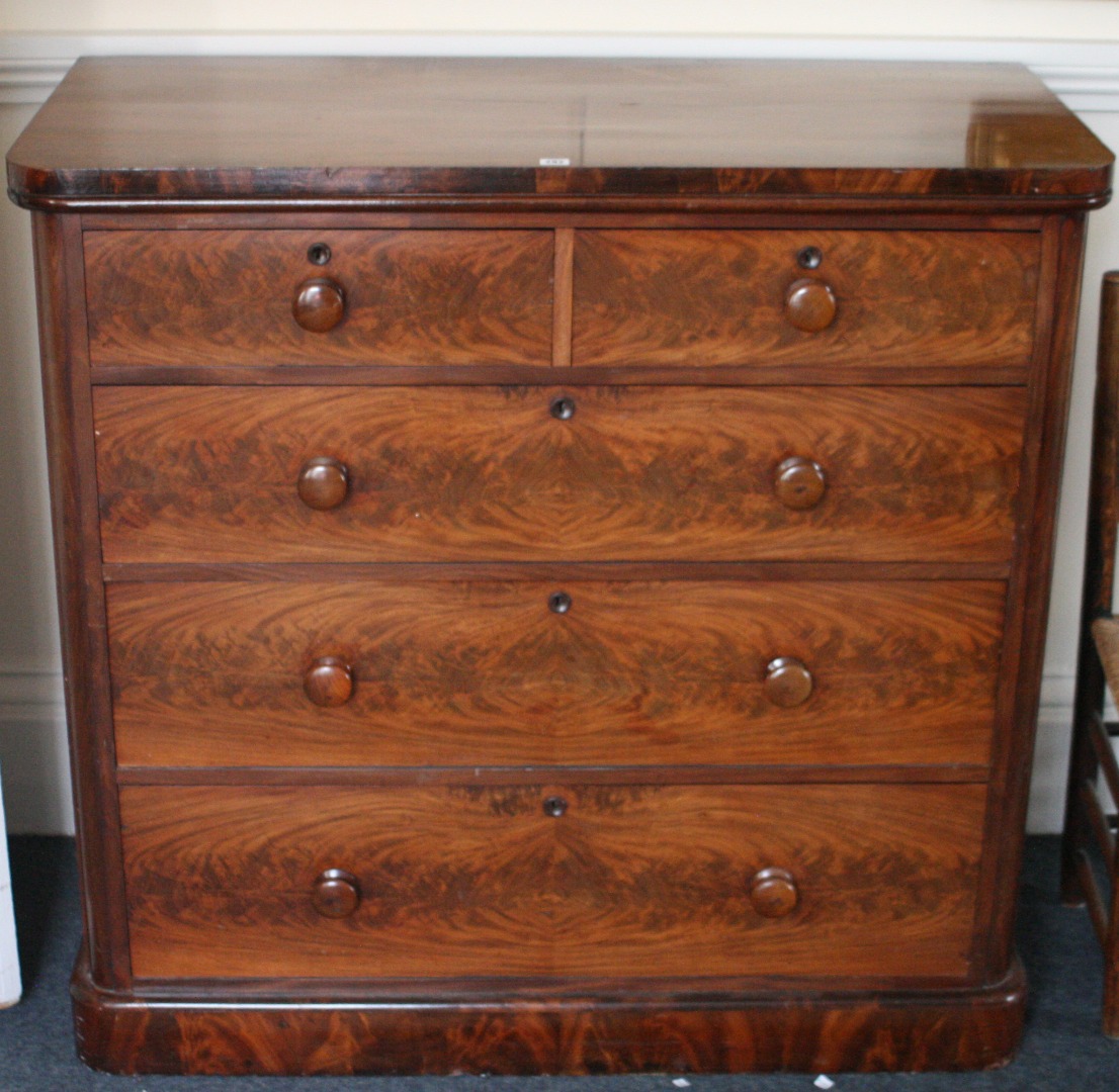 Appraisal: A Victorian mahogany chest fitted with two short and three