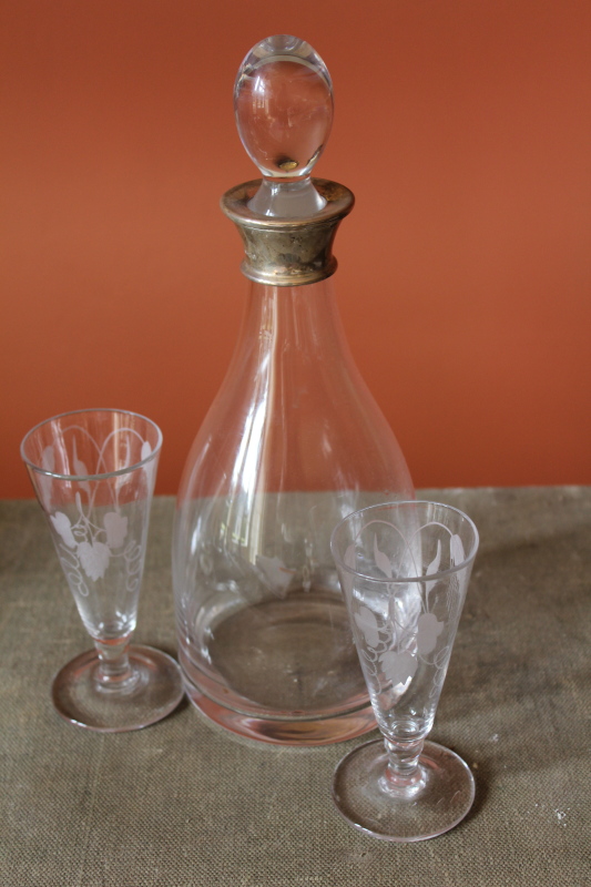 Appraisal: A modern mallet shaped decanter with a silver collar and