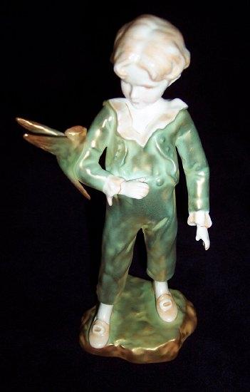 Appraisal: A Royal Worcester figure by Freda Doughty Boy with Parakeet