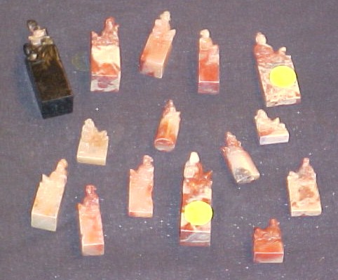 Appraisal: Fourteen Asian hardstone seals all carved with various figures of