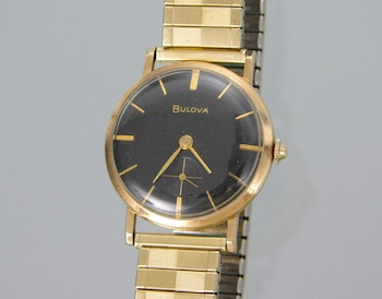 Appraisal: A Vintage Men's Bulova Watch Round gold-filled case black dial