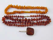 Appraisal: A mixed lot comprising two amber necklaces longest approx cm