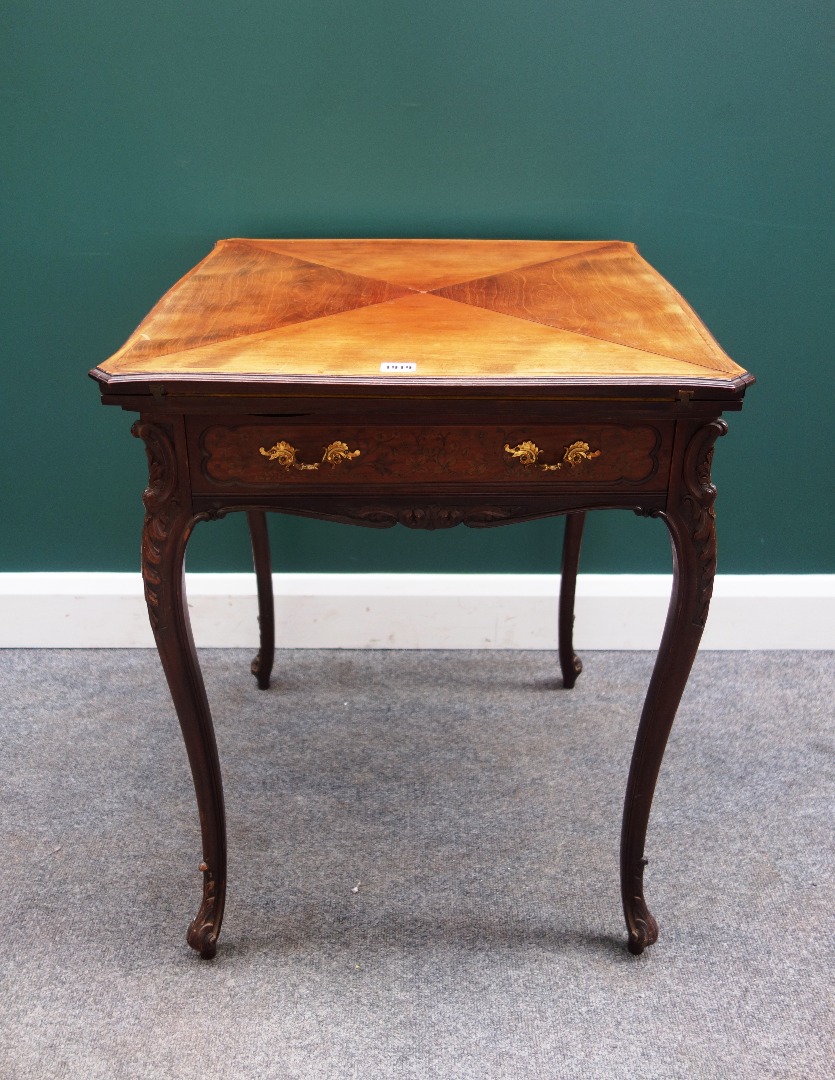 Appraisal: A late th century marquetry inlaid envelope card table with