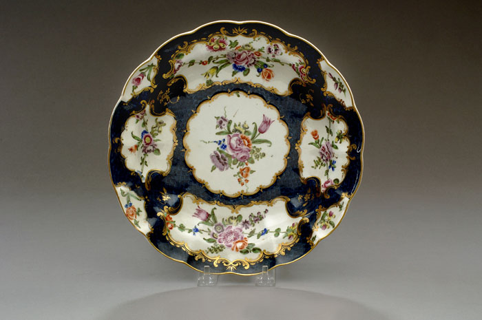 Appraisal: WORCESTER PORCELAIN BLUE-SCALE SCALLOPED DISH CIRCA Reserved in the center