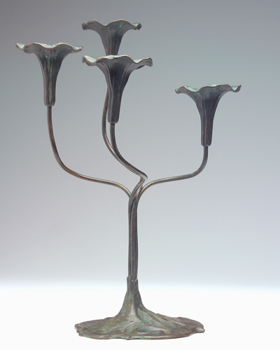 Appraisal: JESSE PRESTON Bronze four-branch candelabra with trumpet flowers on swirling