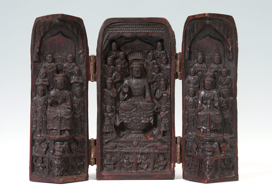 Appraisal: CARVED BUDDHIST TRAVEL ALTAR Opens to triptych with carved seated