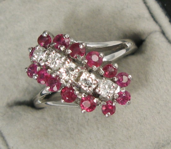 Appraisal: RUBY DIAMOND AND FOURTEEN KARAT GOLD RING set with five