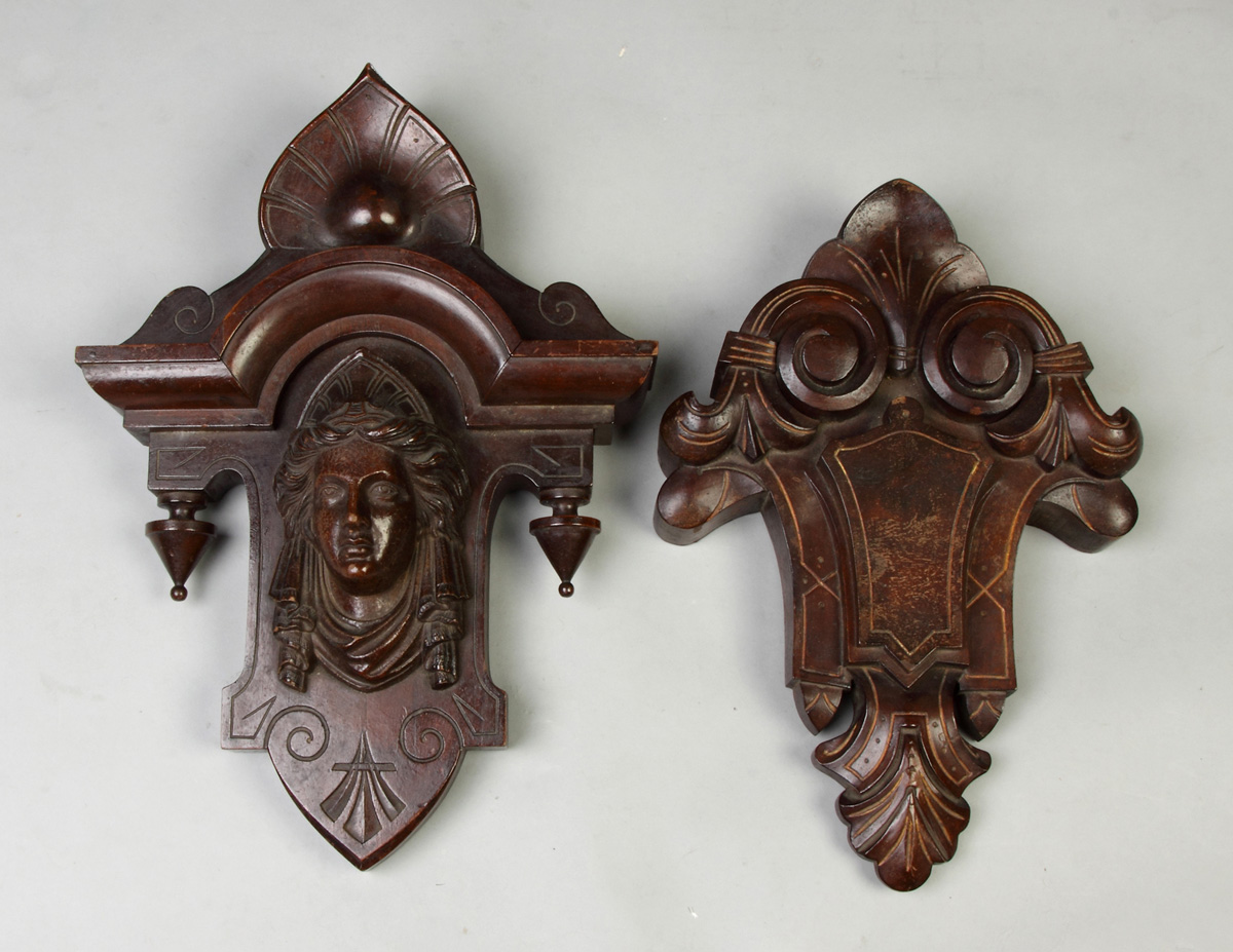 Appraisal: Pair of Victorian Carved Walnut Crests One w composition head