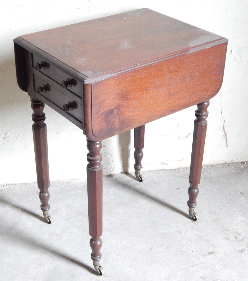 Appraisal: A Victorian mahogany Pembroke table with two frieze drawers opposing