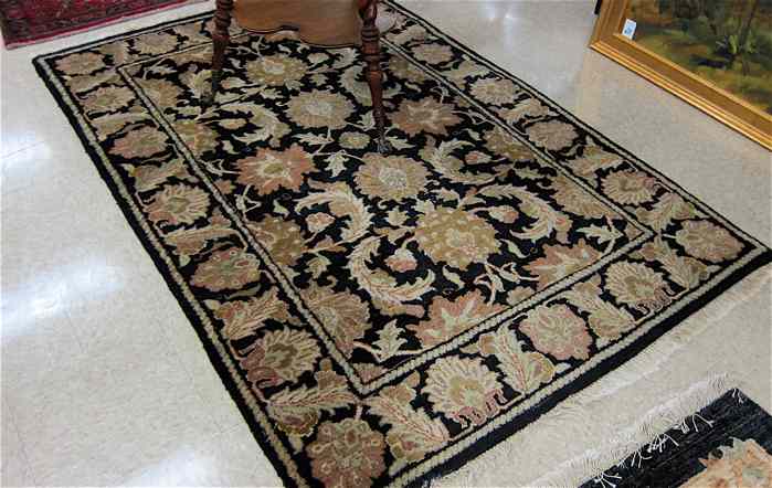 Appraisal: HAND KNOTTED ORIENTAL AREA RUG Indo-Persian overall floral decoration on