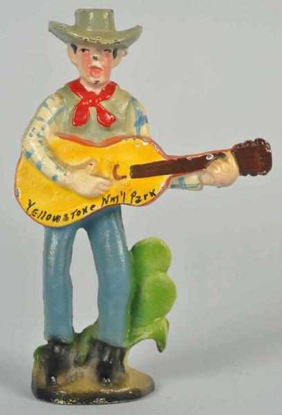 Appraisal: Cast Iron Cowboy with Guitar Bottle Opener John Wright Company