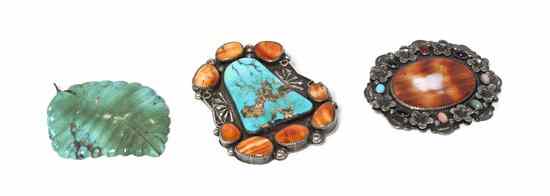 Appraisal: An Oval Shaped Pin having semi precious stones surrounding a