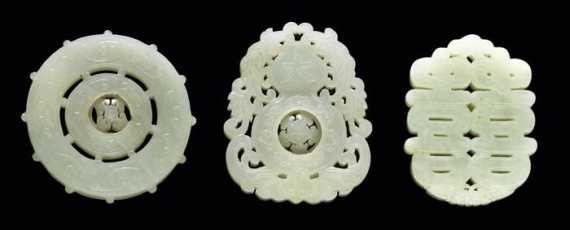 Appraisal: THREE WHITE AND PALE GREEN JADE PENDANTS China early th