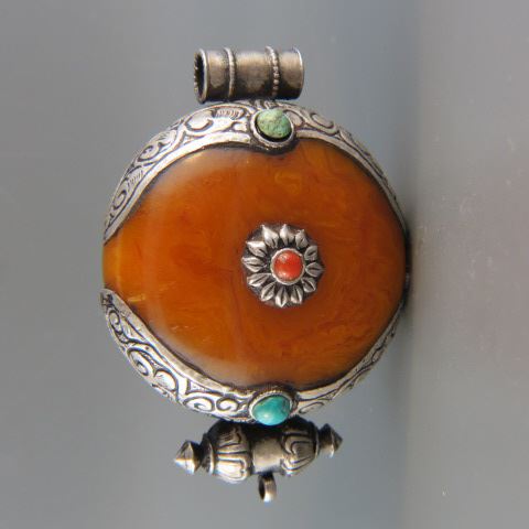 Appraisal: Tibetian Amber Sterling Pendant red coral turquoise inset diameter long