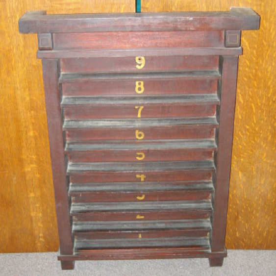 Appraisal: ARTS CRAFTS MAHOGANY POOL BALL RACK with nine shelves each