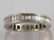 Appraisal: A platinum and baguette cut diamond eternity ring the diamonds