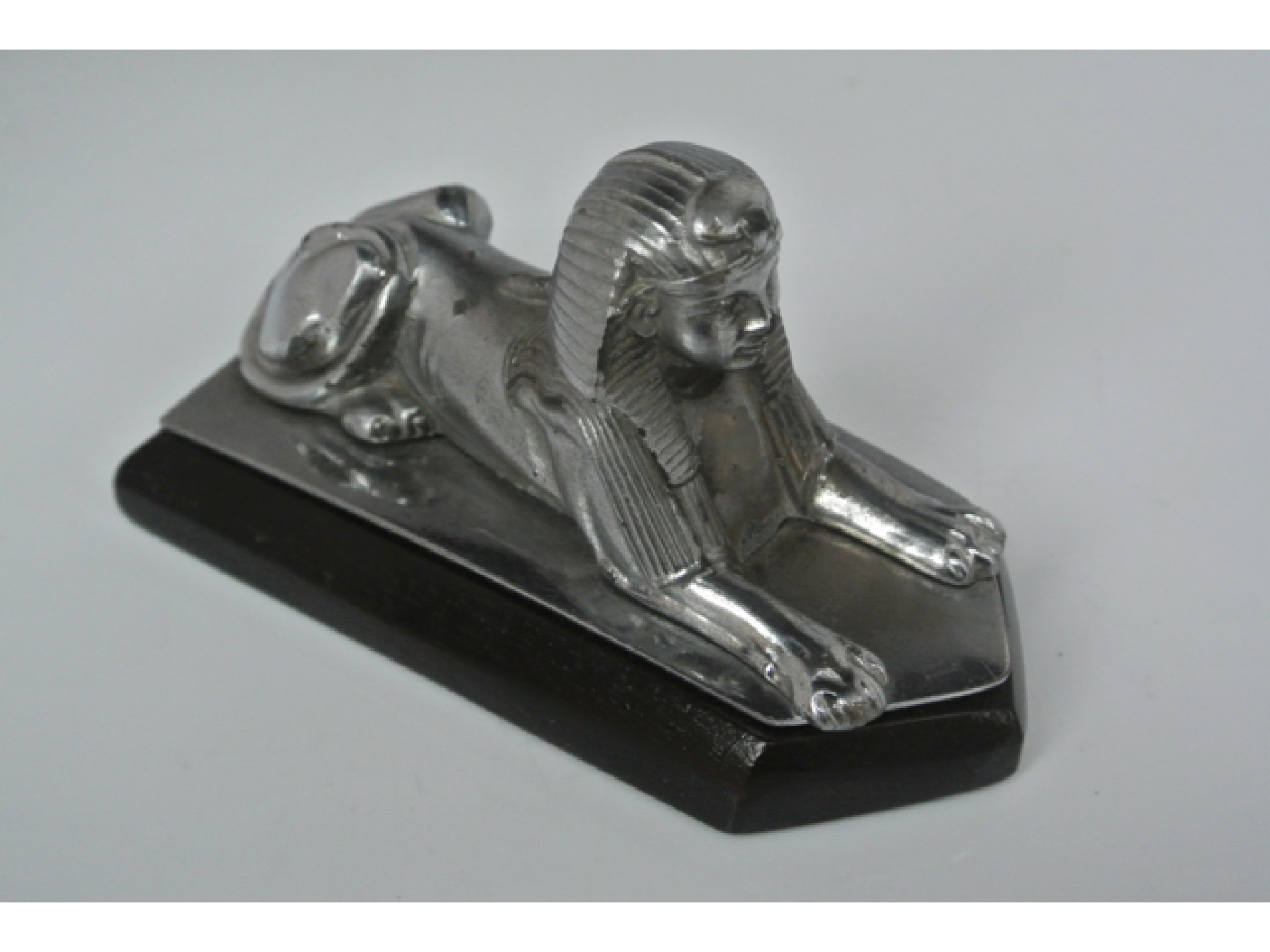 Appraisal: A chromium plated Armstrong Siddeley Sphinx bonnet mascot on a