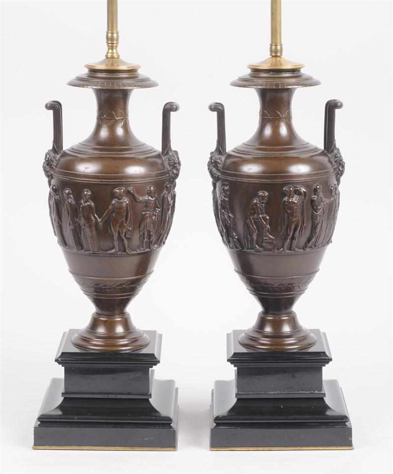 Appraisal: PAIR OF ITALIAN BRONZE PATINATED URNS ON BLACK MARBLE STANDS