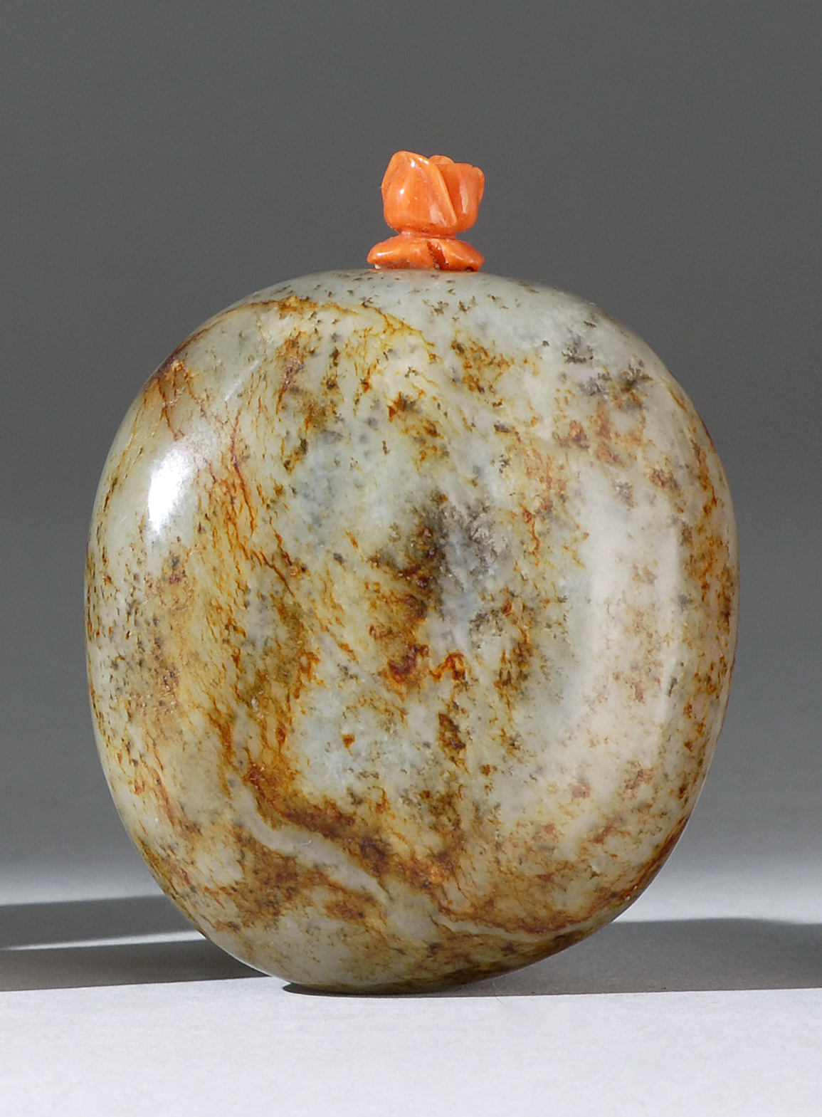 Appraisal: MOTTLED JADE SNUFF BOTTLE Early th CenturyIn smooth rounded pebble