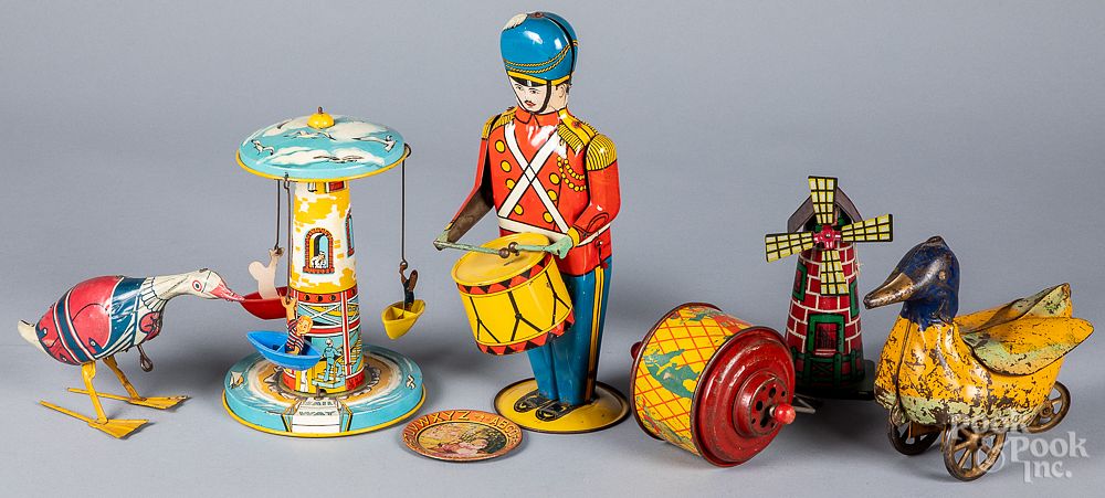 Appraisal: Tin wind-up toys Tin wind-up toys to include a Wolverine