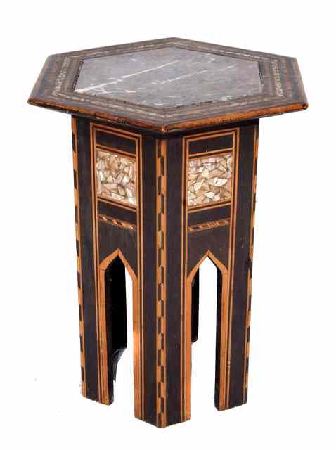 Appraisal: A MOORISH HEXAGONAL TABLE with inset marble top within a