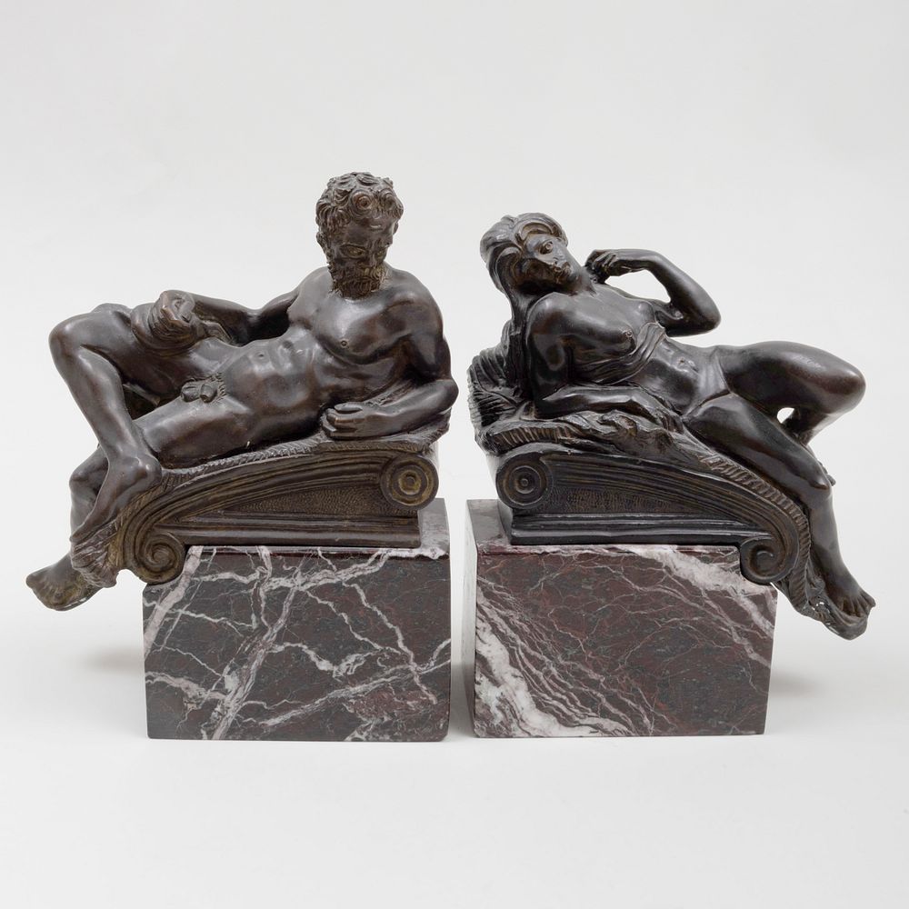 Appraisal: Pair of Bronze and Marble Figural Bookends After Michelangelo x