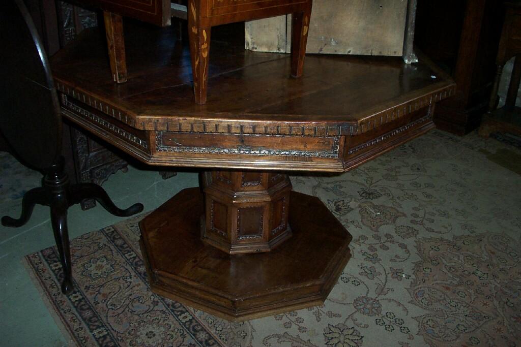 Appraisal: An th century walnut Italian table the octagonal top enclosing