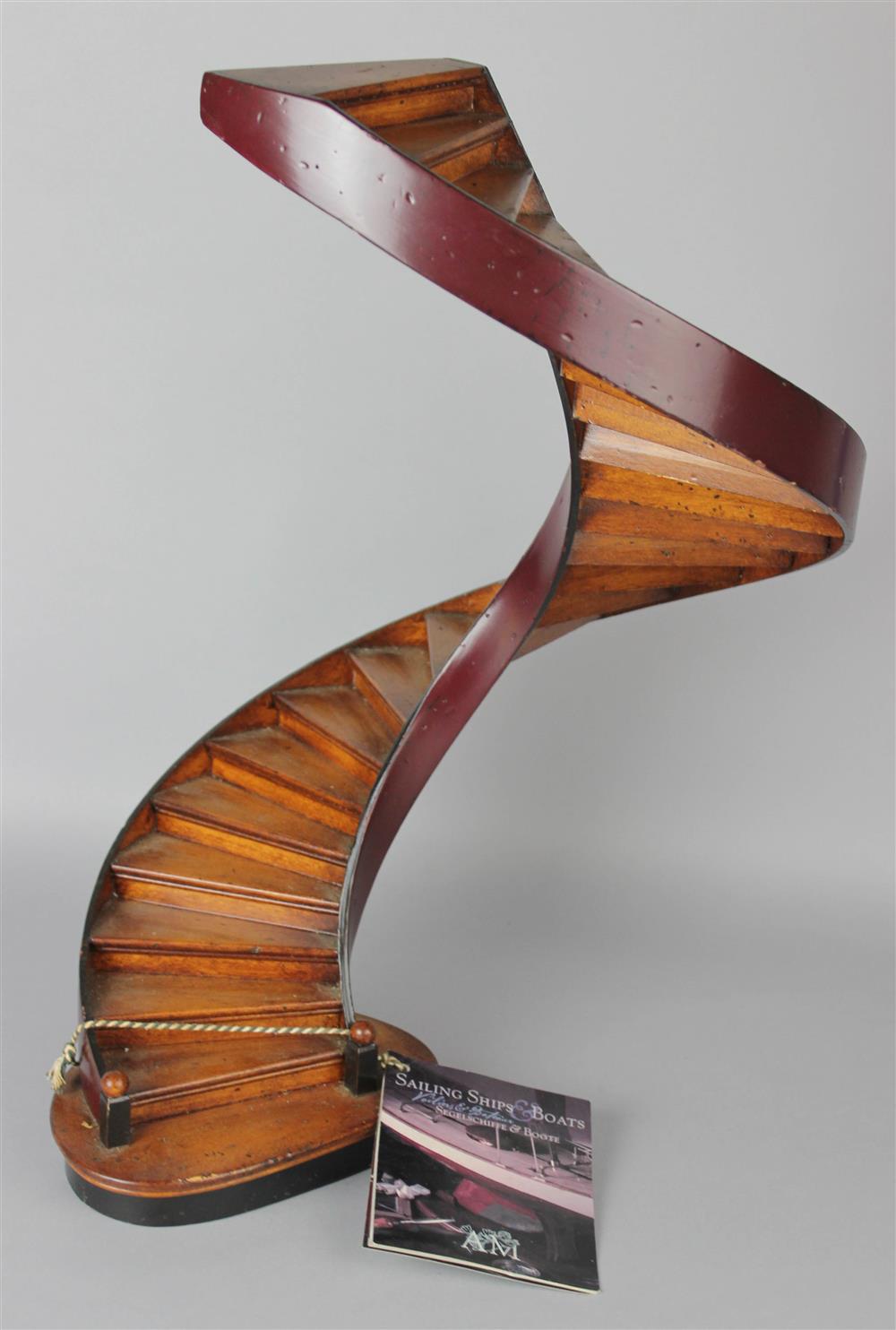 Appraisal: WOOD MODEL SPIRAL STAIRCASE by Authentic Models on a shaped