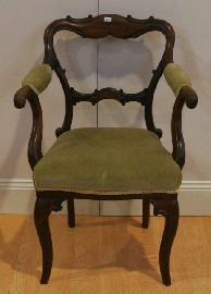 Appraisal: A Victorian rosewood upholstered childs armchair